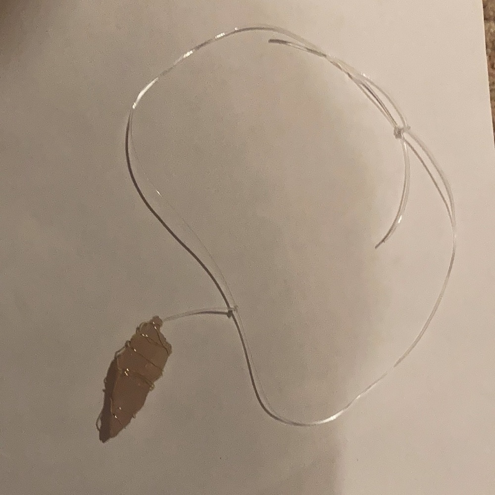 A rose quartz necklace.